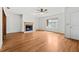 Living room with hardwood floors, fireplace, and door to hallway at 1520 15Th N St, St Petersburg, FL 33704