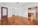 Spacious living room with hardwood floors and an open layout, freshly painted in white at 1520 15Th N St, St Petersburg, FL 33704