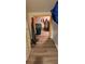 Attic storage space with wood-look flooring and framed doorway at 1550 Chateau Wood Dr, Clearwater, FL 33764