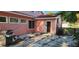Backyard view with a grill and outdoor access points along a stone path at 1550 Chateau Wood Dr, Clearwater, FL 33764
