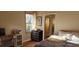 Well-lit bedroom with a large window and a view of the outside at 1550 Chateau Wood Dr, Clearwater, FL 33764