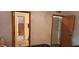 Bedroom with a view of a stairway through an open door and a closed door off to the side at 1550 Chateau Wood Dr, Clearwater, FL 33764