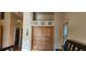 Bedroom featuring a wall closet with a unique wood facade and overhead storage at 1550 Chateau Wood Dr, Clearwater, FL 33764