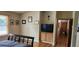 Cozy bedroom with hardwood floors, built-in storage, and a TV for relaxing at 1550 Chateau Wood Dr, Clearwater, FL 33764