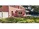 Exterior view of a home, highlighting the lush landscaping, pool, and expansive backyard at 1550 Chateau Wood Dr, Clearwater, FL 33764