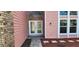 Exterior front entrance with double doors and brick accents at 1550 Chateau Wood Dr, Clearwater, FL 33764