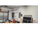 Garage with epoxied floor, storage and overhead door opener system at 1550 Chateau Wood Dr, Clearwater, FL 33764