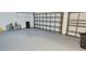 Spacious epoxy garage with overhead door and room for storing bicycles and more at 1550 Chateau Wood Dr, Clearwater, FL 33764