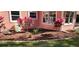 Eye catching landscaping and healthy grass surround the home's exterior at 1550 Chateau Wood Dr, Clearwater, FL 33764