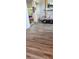 Bright and open living room space featuring updated flooring at 1550 Chateau Wood Dr, Clearwater, FL 33764