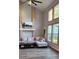 Bright living room with large windows and a cozy fireplace at 1550 Chateau Wood Dr, Clearwater, FL 33764
