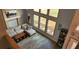 Bright living room featuring a stone fireplace and large windows that provide lots of natural light at 1550 Chateau Wood Dr, Clearwater, FL 33764