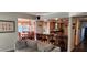 Open concept living room, dining room, and kitchen with breakfast bar at 1550 Chateau Wood Dr, Clearwater, FL 33764