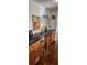 Efficient office space with black granite countertops and wooden cabinets perfect for organization at 1550 Chateau Wood Dr, Clearwater, FL 33764