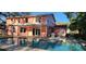 Inviting backyard pool and patio area, perfect for relaxation and outdoor entertaining near the two-story home at 1550 Chateau Wood Dr, Clearwater, FL 33764
