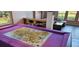 Versatile space with a large table, built-in bookshelf, and access to the living area at 1550 Chateau Wood Dr, Clearwater, FL 33764
