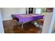 Game room with a multipurpose table and stained concrete floors at 1550 Chateau Wood Dr, Clearwater, FL 33764