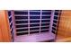 Interior of a modern sauna with wooden benches and sleek, minimalist design, creating a relaxing atmosphere at 1550 Chateau Wood Dr, Clearwater, FL 33764