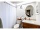 Bright bathroom with a white vanity, new fixtures, and shiplap walls at 1857 Castle Woods Dr, Clearwater, FL 33759