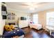 bedroom featuring two twin beds, hardwood flooring, ceiling fan and decor at 1857 Castle Woods Dr, Clearwater, FL 33759