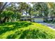 Charming two-story home with a well-manicured lawn and a two car garage at 1857 Castle Woods Dr, Clearwater, FL 33759