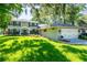 A two-story home with a well-maintained lawn and an attached two-car garage at 1857 Castle Woods Dr, Clearwater, FL 33759