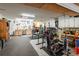 Large garage featuring an exercise space, tools, storage, and work bench at 1857 Castle Woods Dr, Clearwater, FL 33759