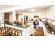Spacious kitchen with stainless steel appliances, bar seating, and dark hardwood floors at 1857 Castle Woods Dr, Clearwater, FL 33759