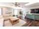 Cozy living room featuring a comfortable sofa, wood flooring, and plenty of natural light at 1857 Castle Woods Dr, Clearwater, FL 33759