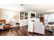 Inviting living room with built-in shelving, fireplace, and hardwood flooring at 1857 Castle Woods Dr, Clearwater, FL 33759
