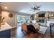 Cozy living room featuring a stone fireplace and sliding glass doors to the patio at 1857 Castle Woods Dr, Clearwater, FL 33759