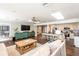 Open-concept living space featuring a kitchen with bar seating and a cozy living area at 1857 Castle Woods Dr, Clearwater, FL 33759