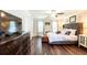 Beautiful main bedroom boasts hardwood floors, a fireplace, and ample natural light at 1857 Castle Woods Dr, Clearwater, FL 33759