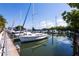 Marina with several sailboats and yachts docked on a sunny day at 1857 Castle Woods Dr, Clearwater, FL 33759