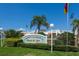 View of the Safety Harbor Resort & Spa sign, surrounded by lush green landscaping at 1857 Castle Woods Dr, Clearwater, FL 33759