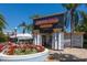Exterior of Fountain Grille Restaurant, with lush flower beds and outdoor seating at 1857 Castle Woods Dr, Clearwater, FL 33759