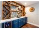 The wet bar features wooden shelving, cabinets and a wine fridge at 1857 Castle Woods Dr, Clearwater, FL 33759