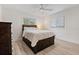 Well-lit bedroom featuring wood floors, a large bed and a window at 2049 Massachusetts Ne Ave, St Petersburg, FL 33703