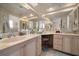 Bright bathroom with double vanity, cream cabinets, and a large mirror at 2102 S Fore Cir, Tampa, FL 33612