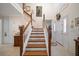 Grand foyer with a staircase, tile flooring, and lots of natural light at 2102 S Fore Cir, Tampa, FL 33612