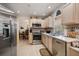 Classic kitchen featuring stainless steel appliances, light wood cabinetry, and tile floors at 2102 S Fore Cir, Tampa, FL 33612