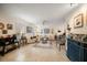 Bright and airy living room with neutral tones, tile flooring, and comfortable seating at 2102 S Fore Cir, Tampa, FL 33612