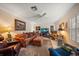 Cozy living room with ample seating, warm lighting, and entertainment center at 2102 S Fore Cir, Tampa, FL 33612