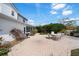 Relaxing backyard brick patio including an outdoor table with seating for six and a grill at 2102 S Fore Cir, Tampa, FL 33612