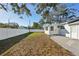Spacious backyard with white fence, lawn and view of church in the background at 2320 E Harbor S Dr, St Petersburg, FL 33705