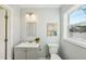Light and airy bathroom featuring a modern vanity, decor, and a window for natural light at 2320 E Harbor S Dr, St Petersburg, FL 33705