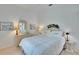 Bright bedroom with white walls, a queen bed, and neutral-toned furniture at 2823 Clubhouse Dr, Plant City, FL 33566
