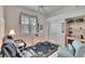 Sitting room with white walls, tropical-themed rug, and comfortable seating at 2823 Clubhouse Dr, Plant City, FL 33566