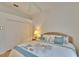 Bedroom featuring a comfortable bed, soft lighting, and a closet with classic doors at 2823 Clubhouse Dr, Plant City, FL 33566