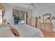 Bedroom with hardwood floors, neutral decor, and natural light at 2823 Clubhouse Dr, Plant City, FL 33566